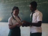 Sheila and Paulo demonstrating how to put a condom on a banana - they did a great job!